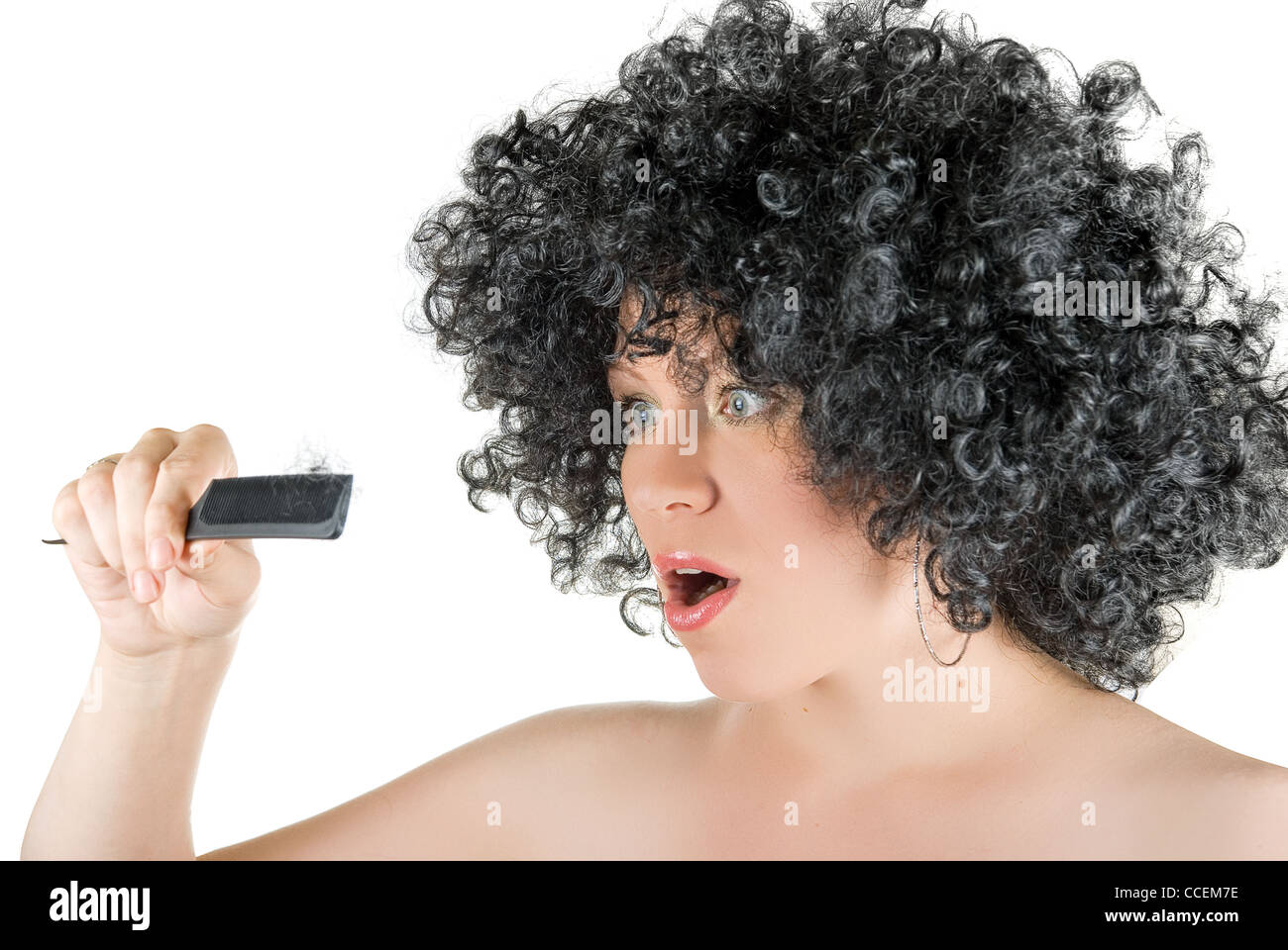 Beautiful Young Frizzy Woman With Hair At Comb Isolated Over White