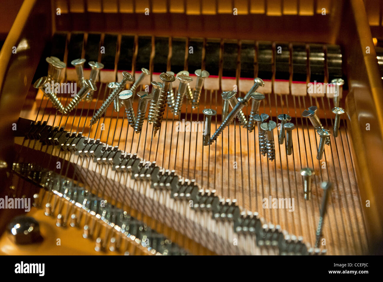 prepared piano" A prepared piano is a piano that has had its sound altered  by placing objects between strings Stock Photo - Alamy