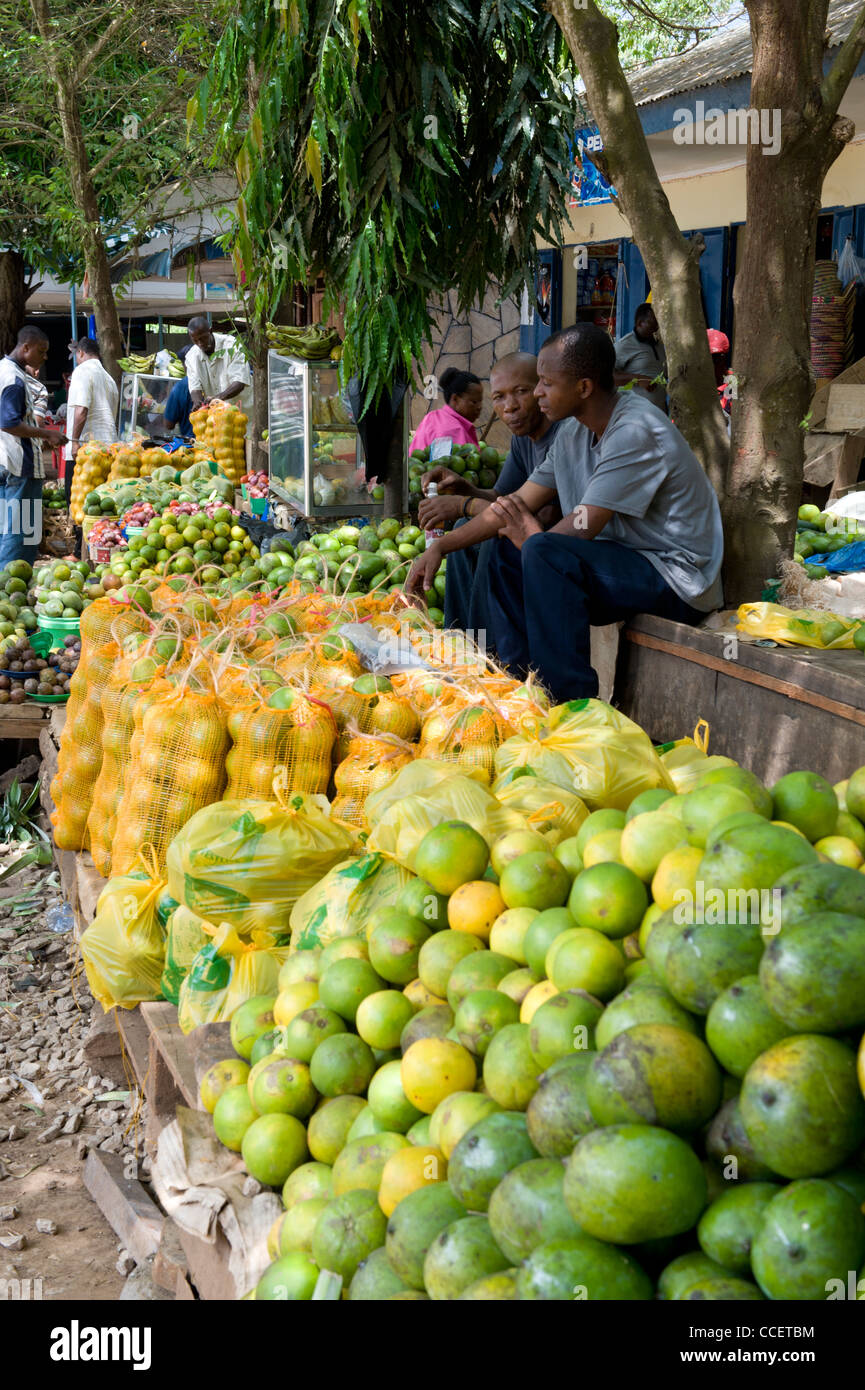 Fruit stand and passengers at Korogwe bus stand Tanga Region Tanzania Stock Photo