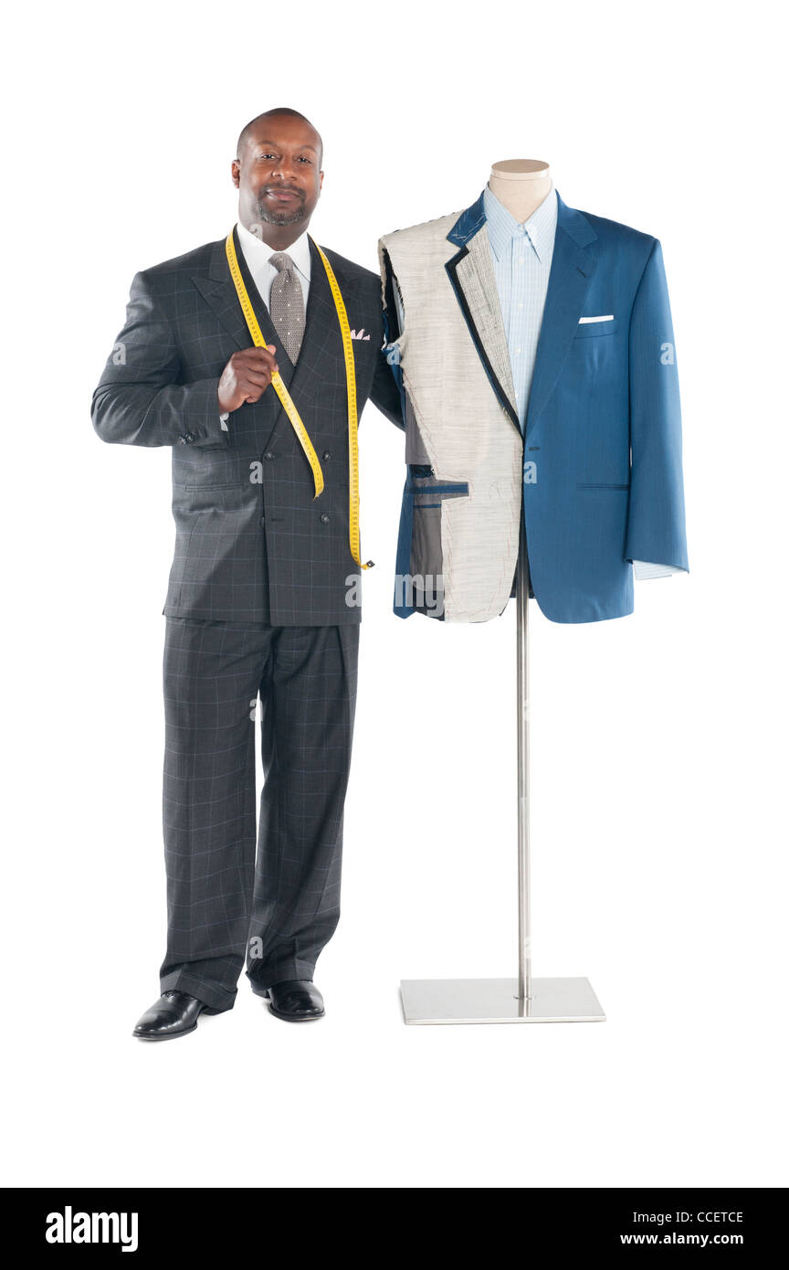 Portrait of tailor standing with mannequin Stock Photo