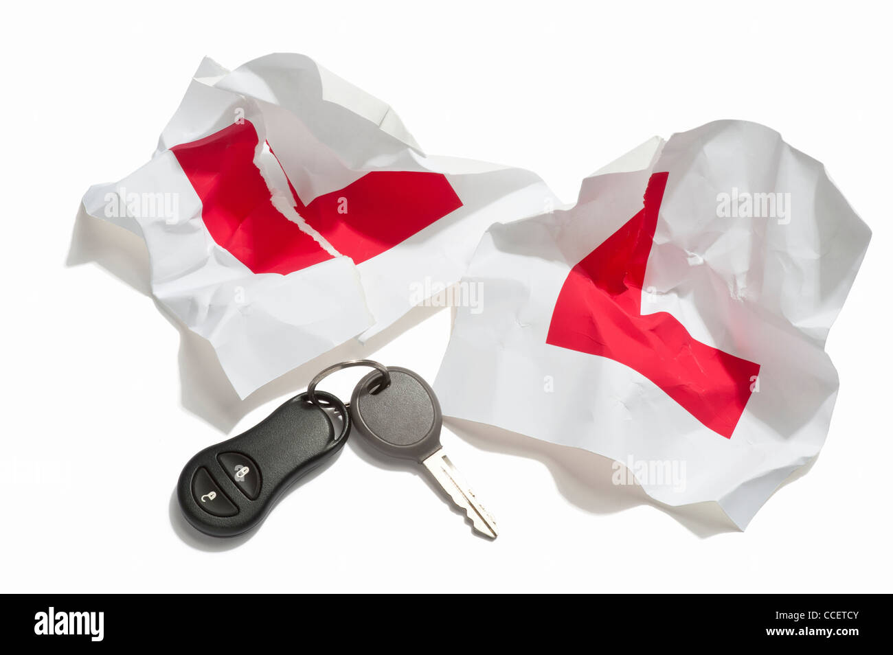 Crumpled L plates with a car key and remote key fob Stock Photo