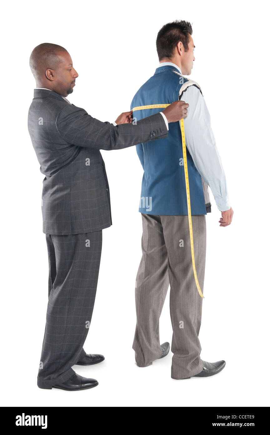 Man having back measured by tailor Stock Photo