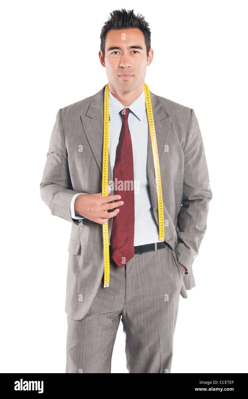 Portrait of handsome tailor standing over white background Stock Photo