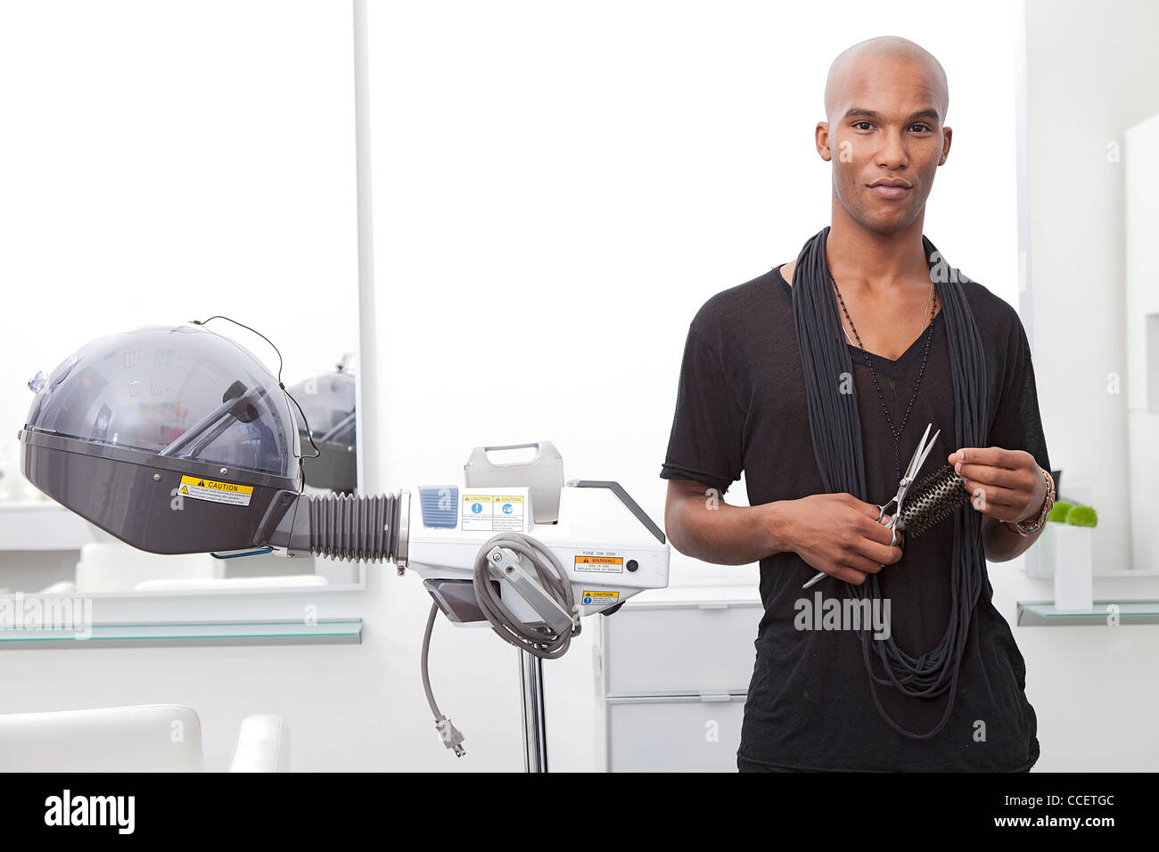 Portrait of African male hairdresser Stock Photo