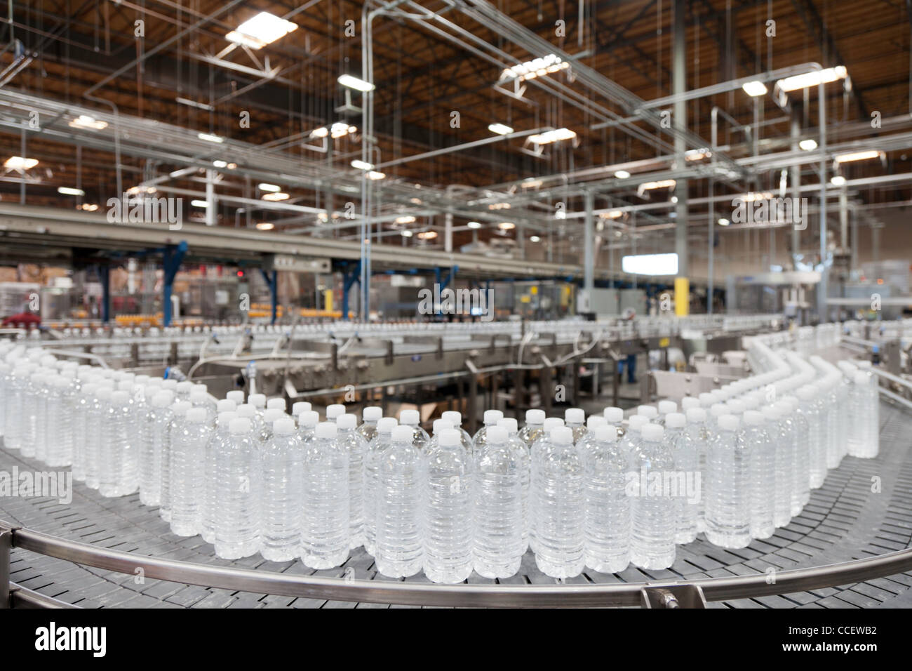 Bottled water on conveyor at bottling plant Stock Photo Alamy