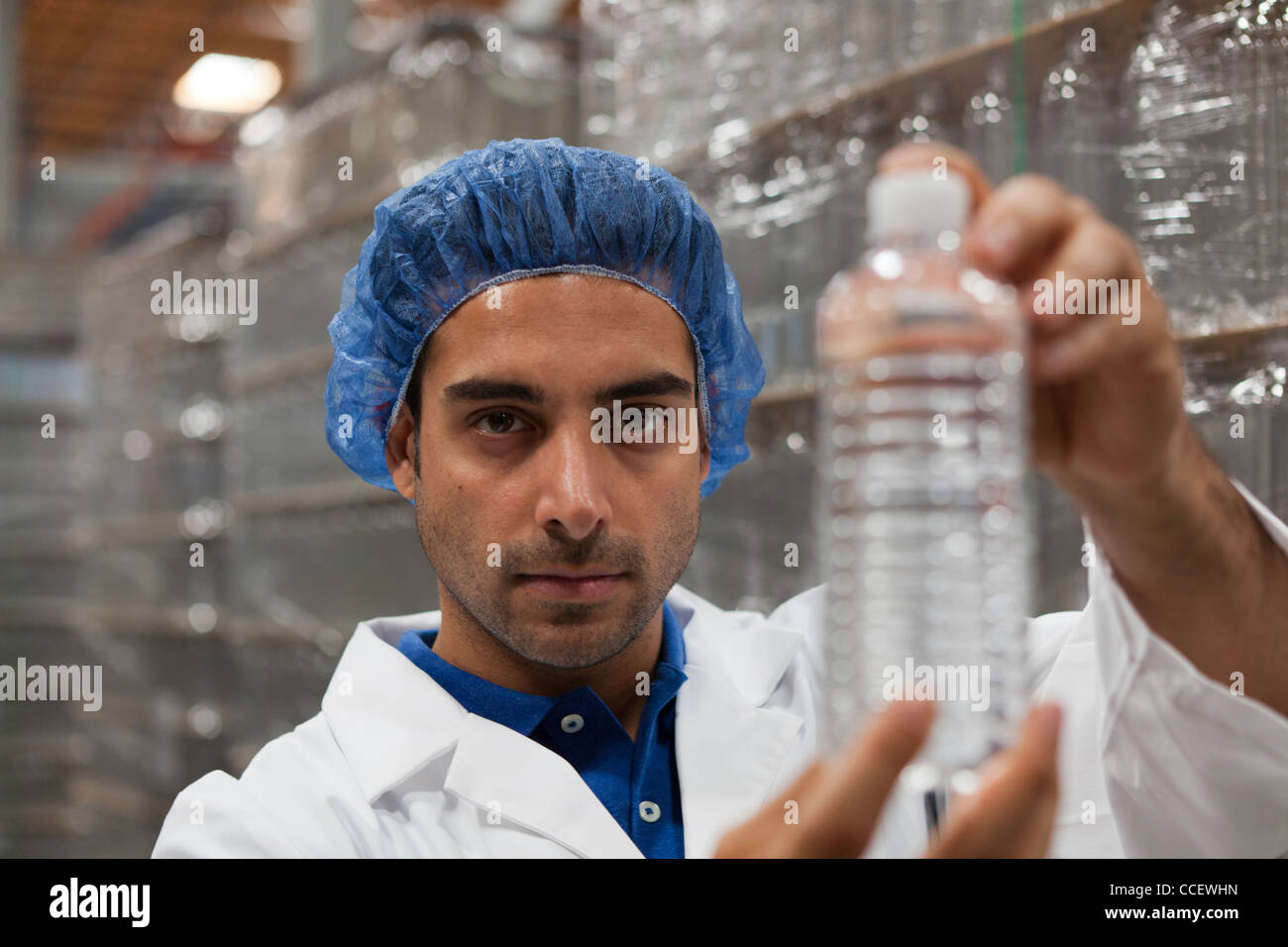 Portrait of factory worker holding water bottle Stock Photo Alamy