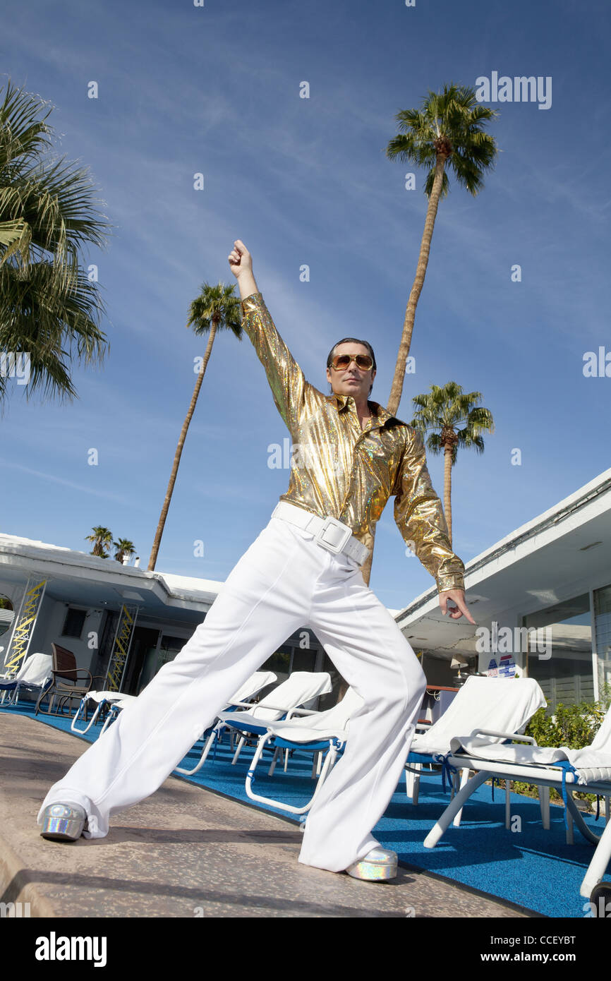 Low angle view of man impersonating Elvis Presley Stock Photo