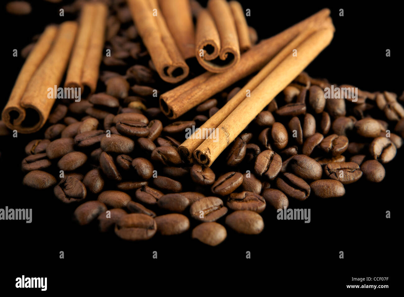 Coffee beans with cinnamon sticks Stock Photo