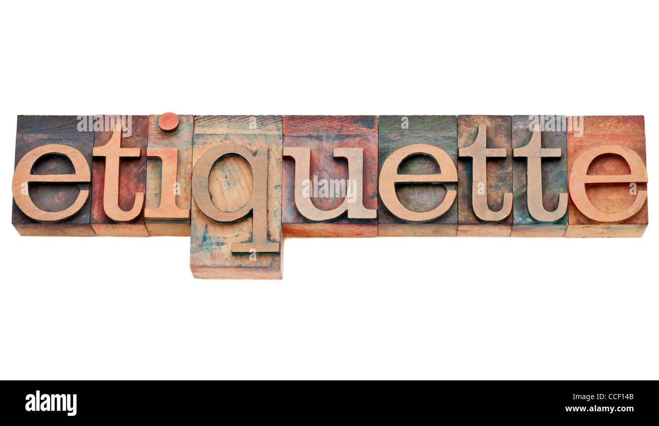 etiquette - courtesy or protocol concept - isolated text in vintage wood letterpress type, stained by color inks Stock Photo