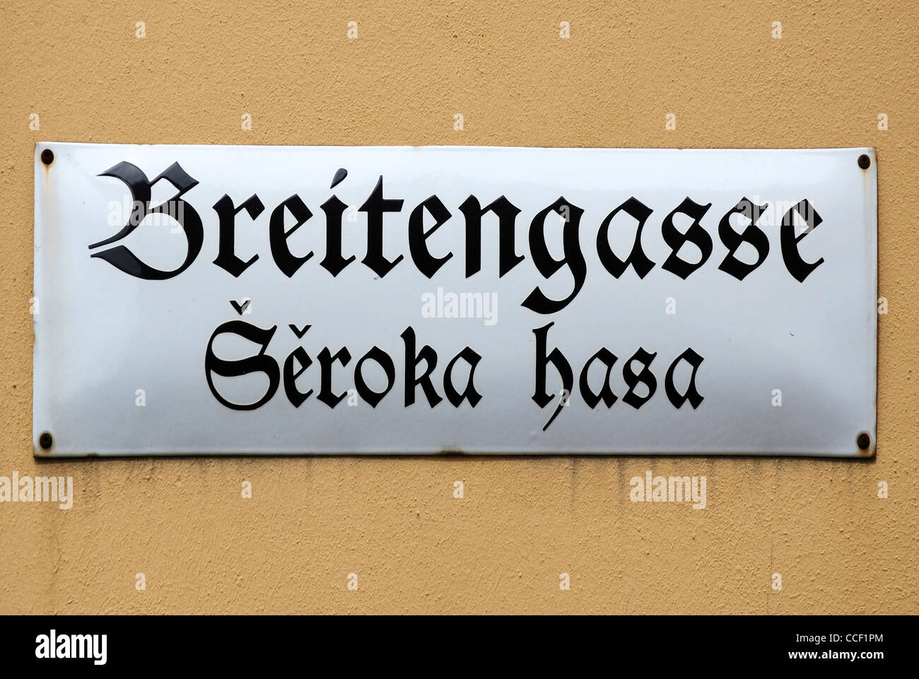 Street sign of Bautzen in German and Sorbian language at the Breitengasse - Seroka hasa. Stock Photo