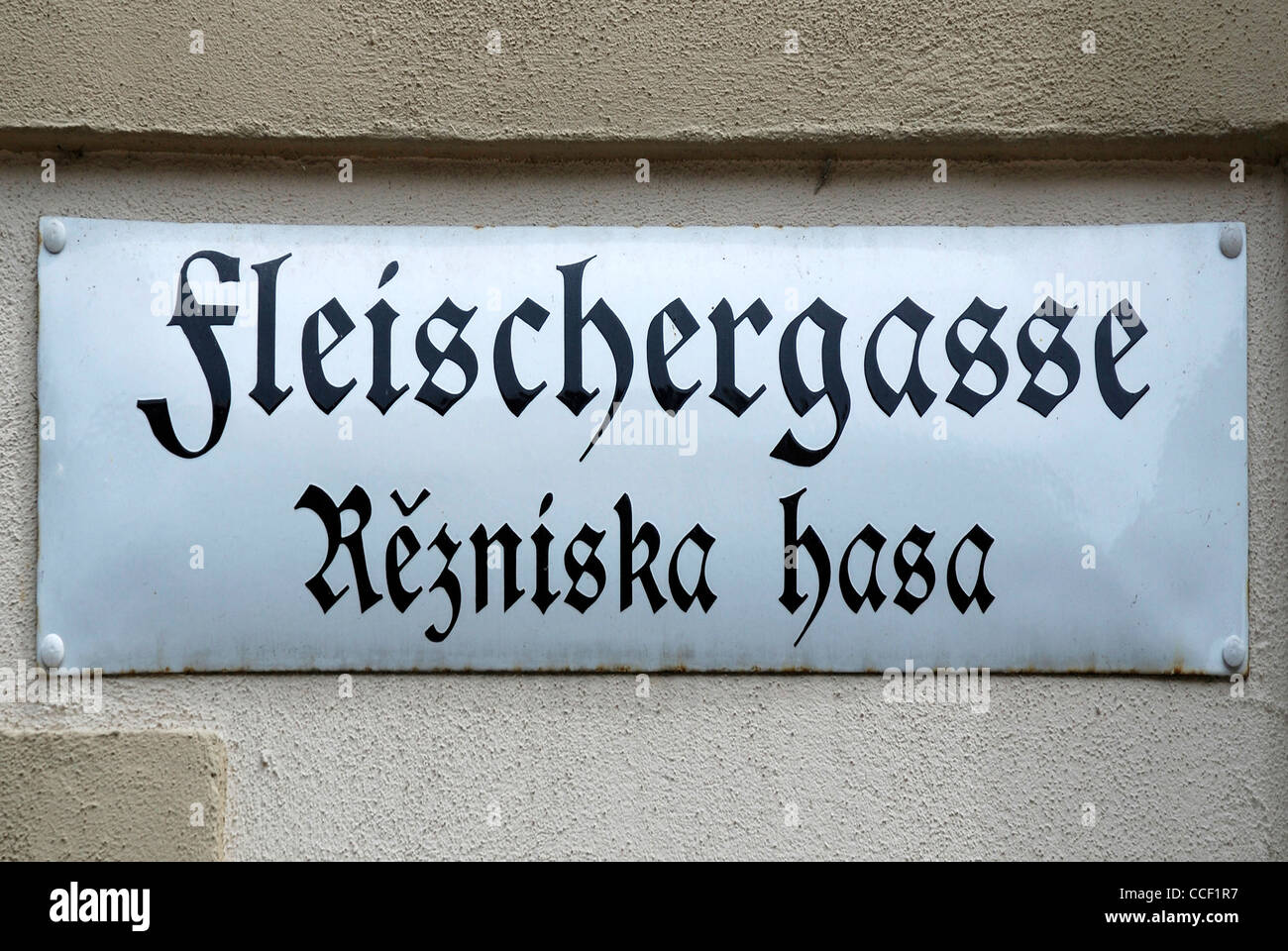 Street sign of Bautzen in German and Sorbian language at the Fleischergasse - Rezniska hasa. Stock Photo