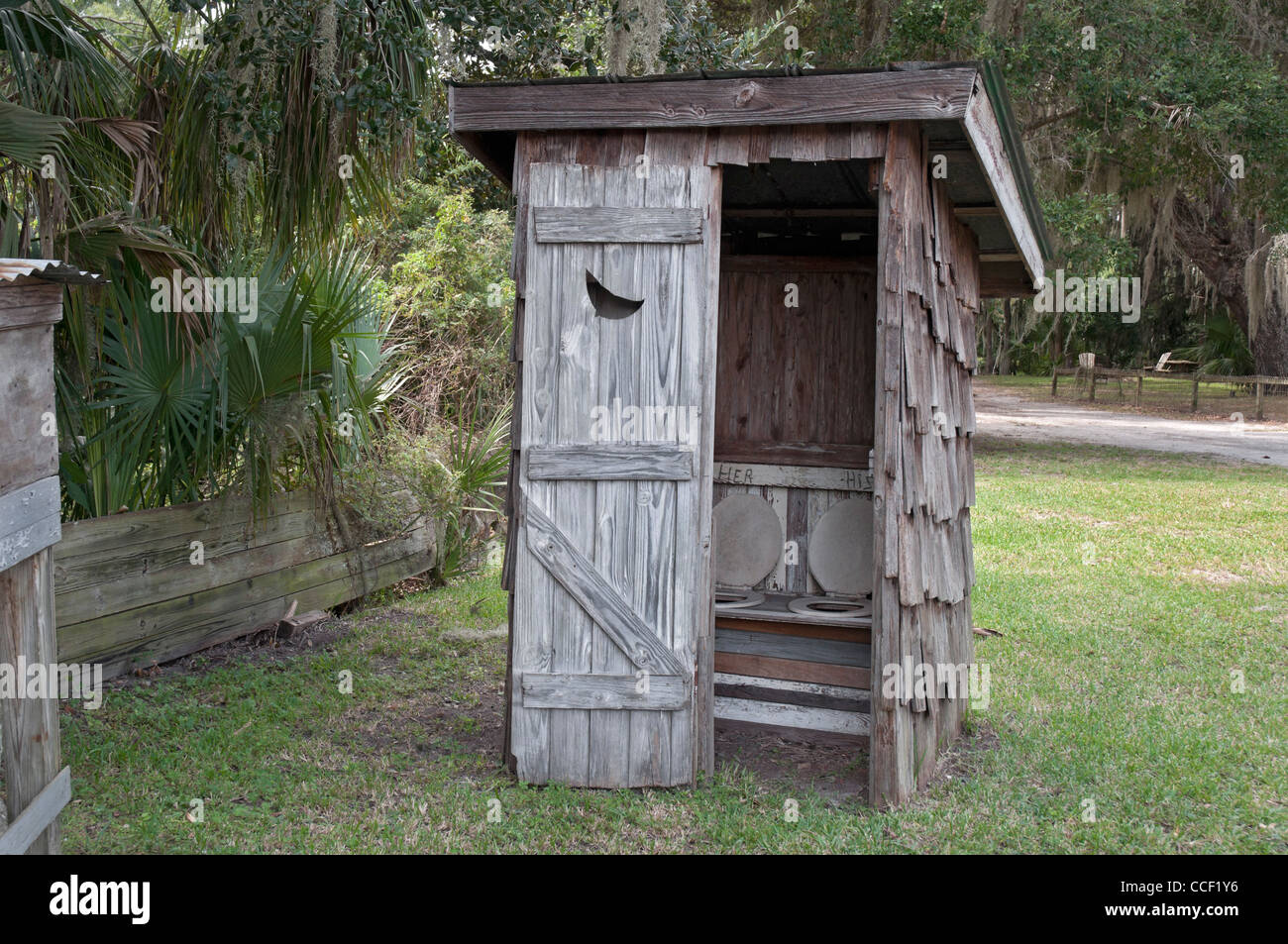 Cross Creek old outhouse with his & hers toilet seats Stock Photo