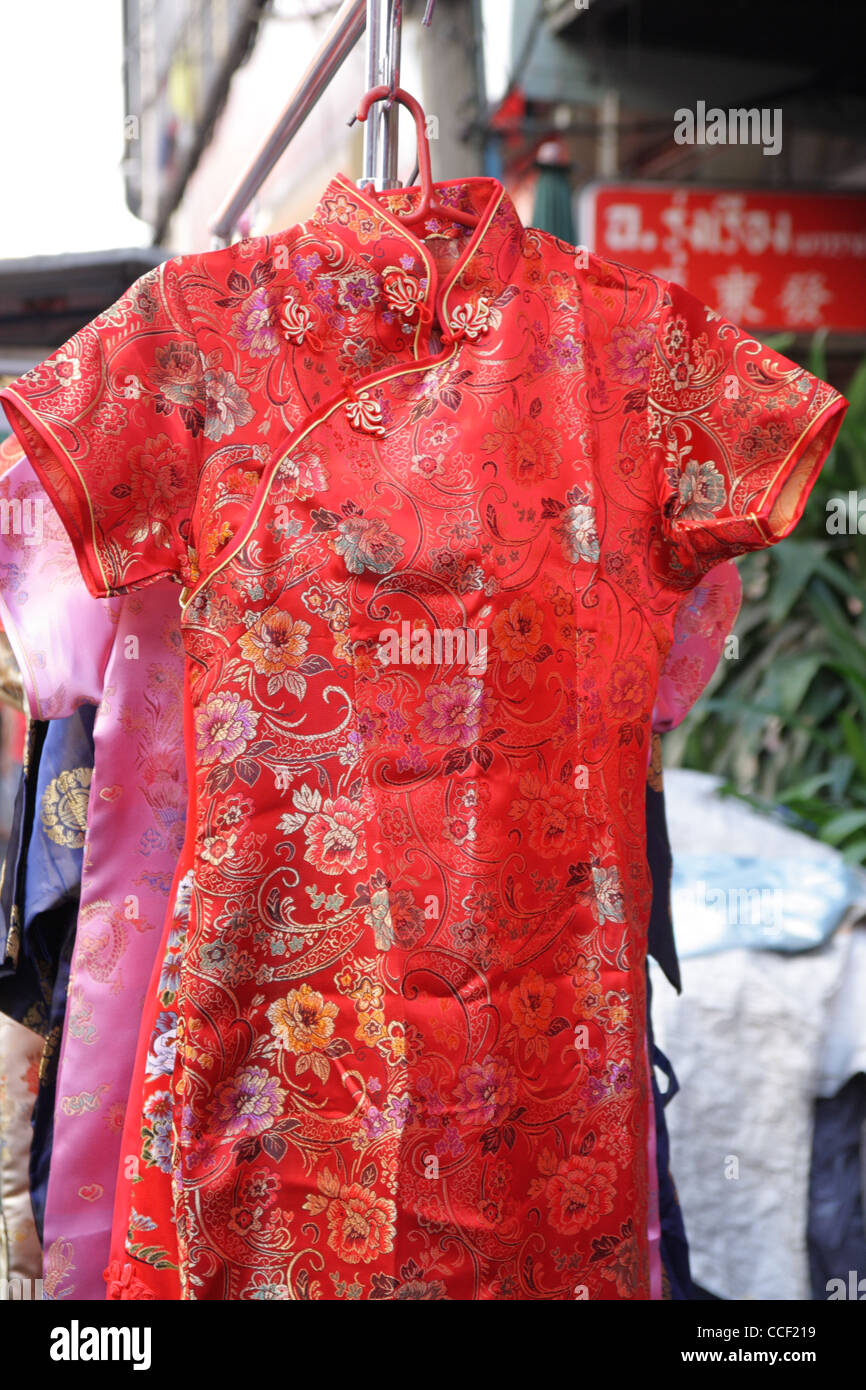 Little girl and Angpao. Children personality in red cheongsam