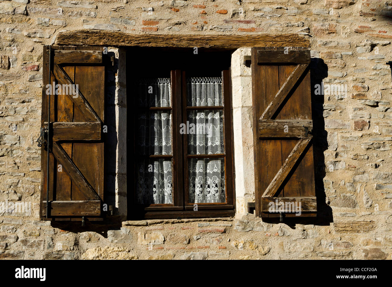 French Brown Wood Shuttered Window In Stone Wall Lace Curtains