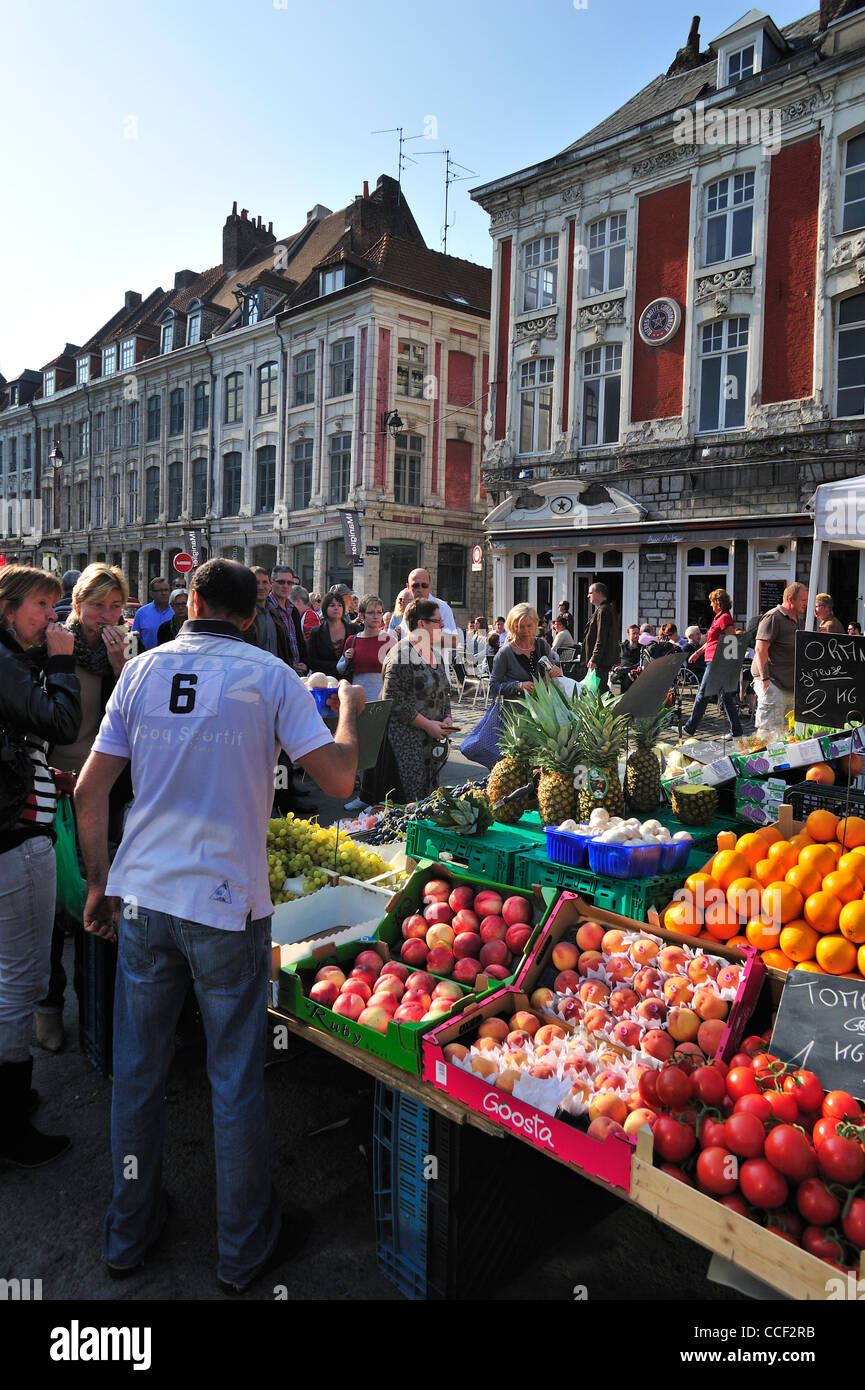 Customers buying fruit and vegetables at market stall, Lille, France Stock Photo