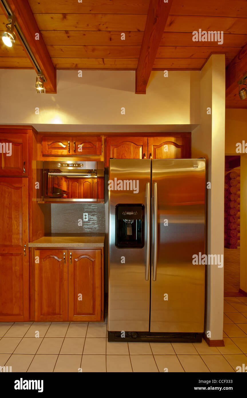 Refrigerator And Kitchen Cabinets Featured In This Luxury Log