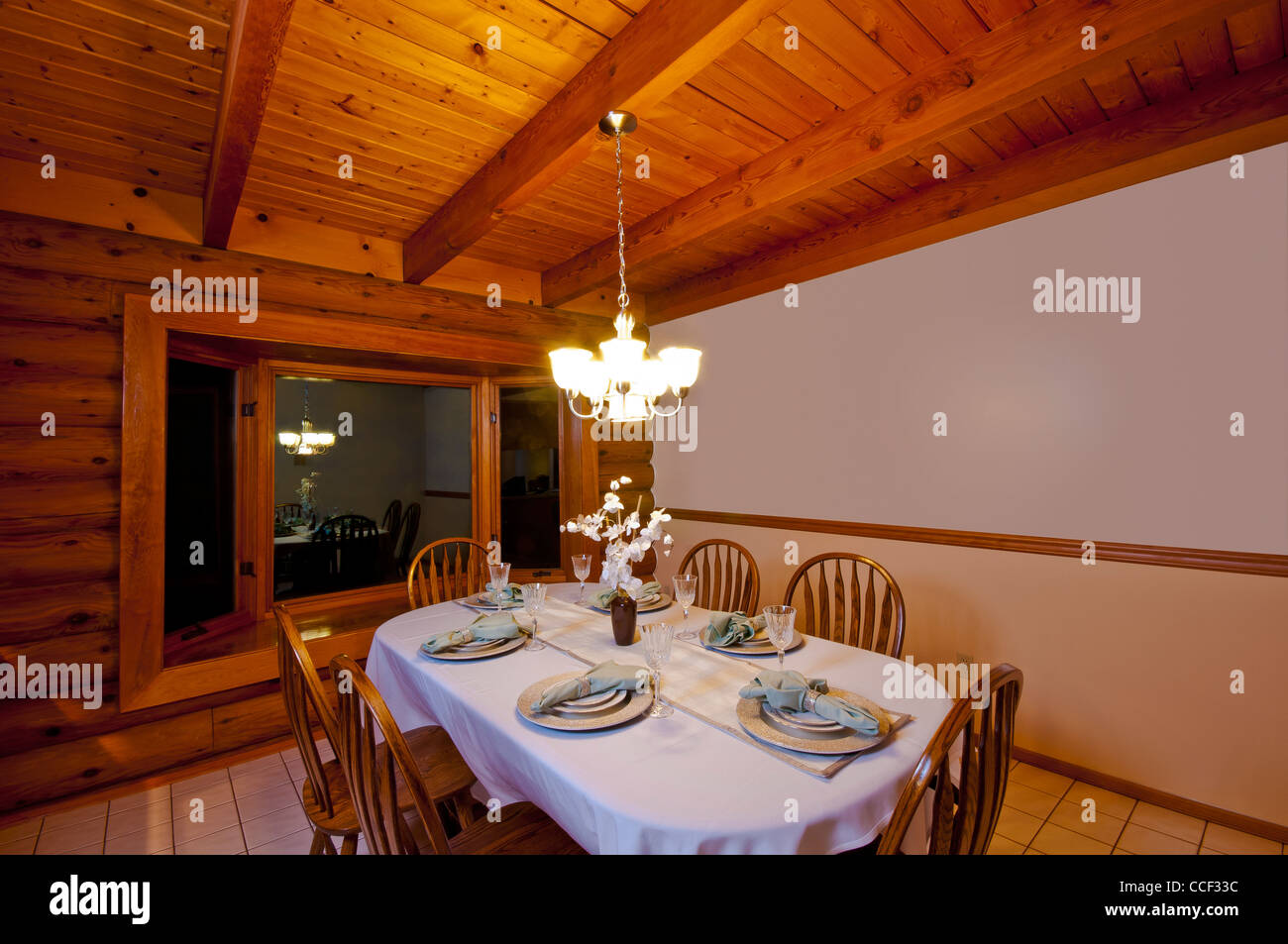 Dining Room In Rustic Luxury Log Cabin Showing Table Chairs