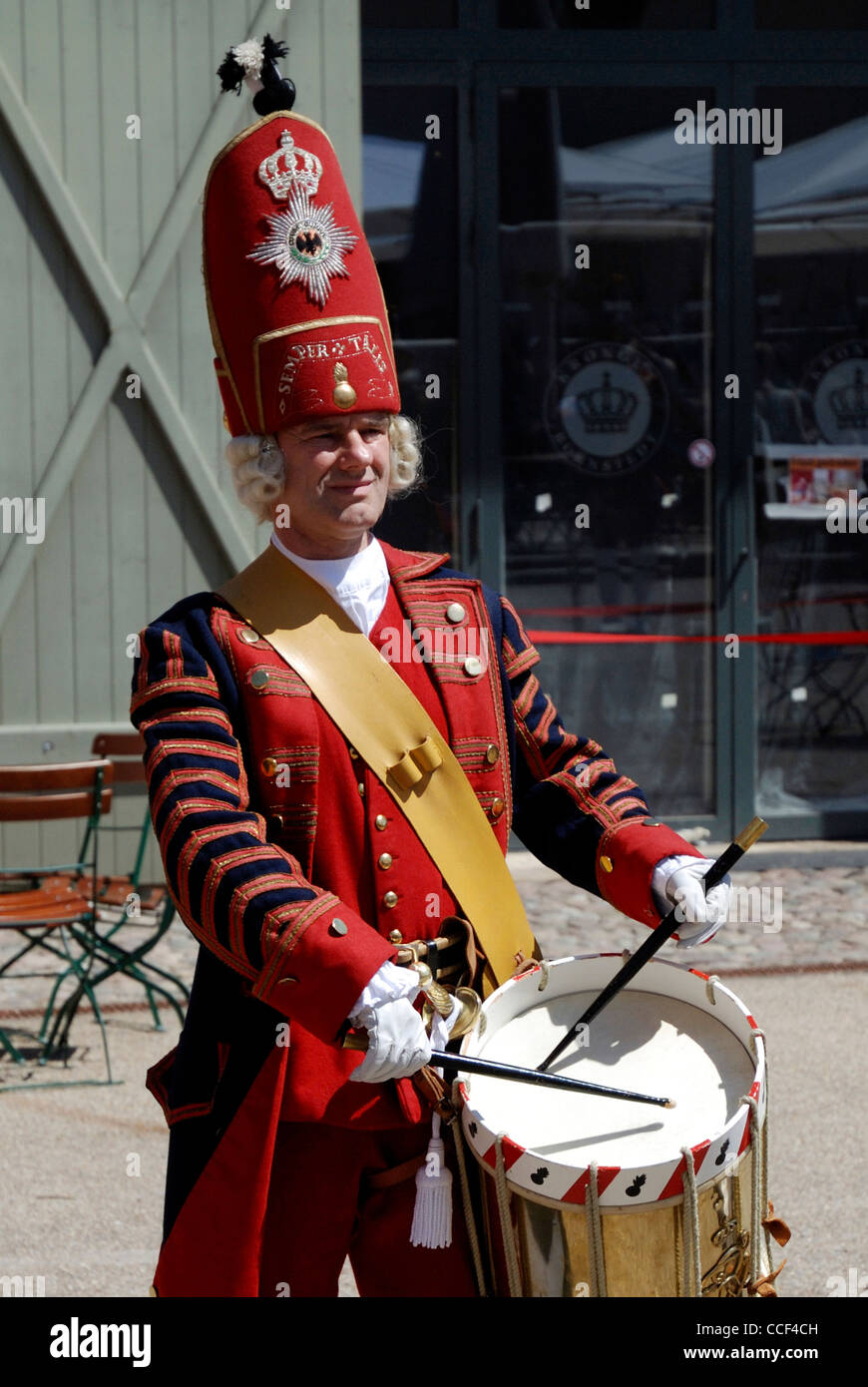 Drummer of the 'Potsdamer Riesengarde' in historical Prussian uniform on the Krongut Bornstedt in Potsdam. Stock Photo