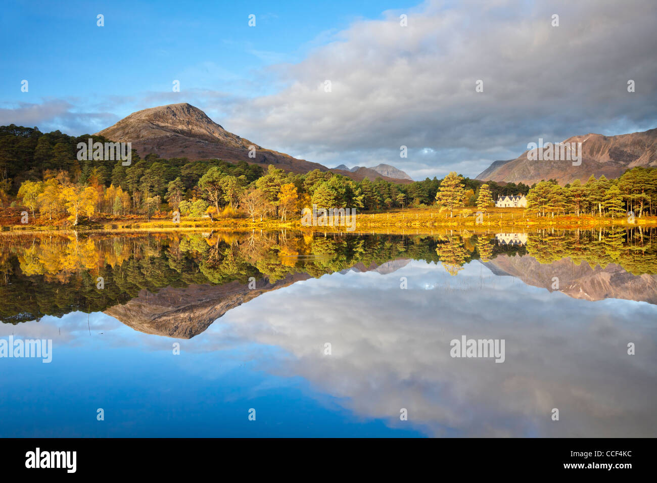 Loch Coulin in the Torridon Mountains, Scotland.  Captured on a still morning in October with reflections of Coulin Lodge Stock Photo