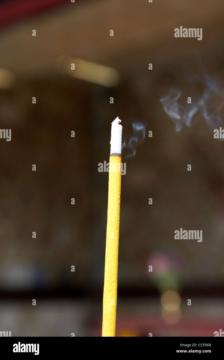 burning incense joss stick in columbarium po fook hill cemetery sha tin