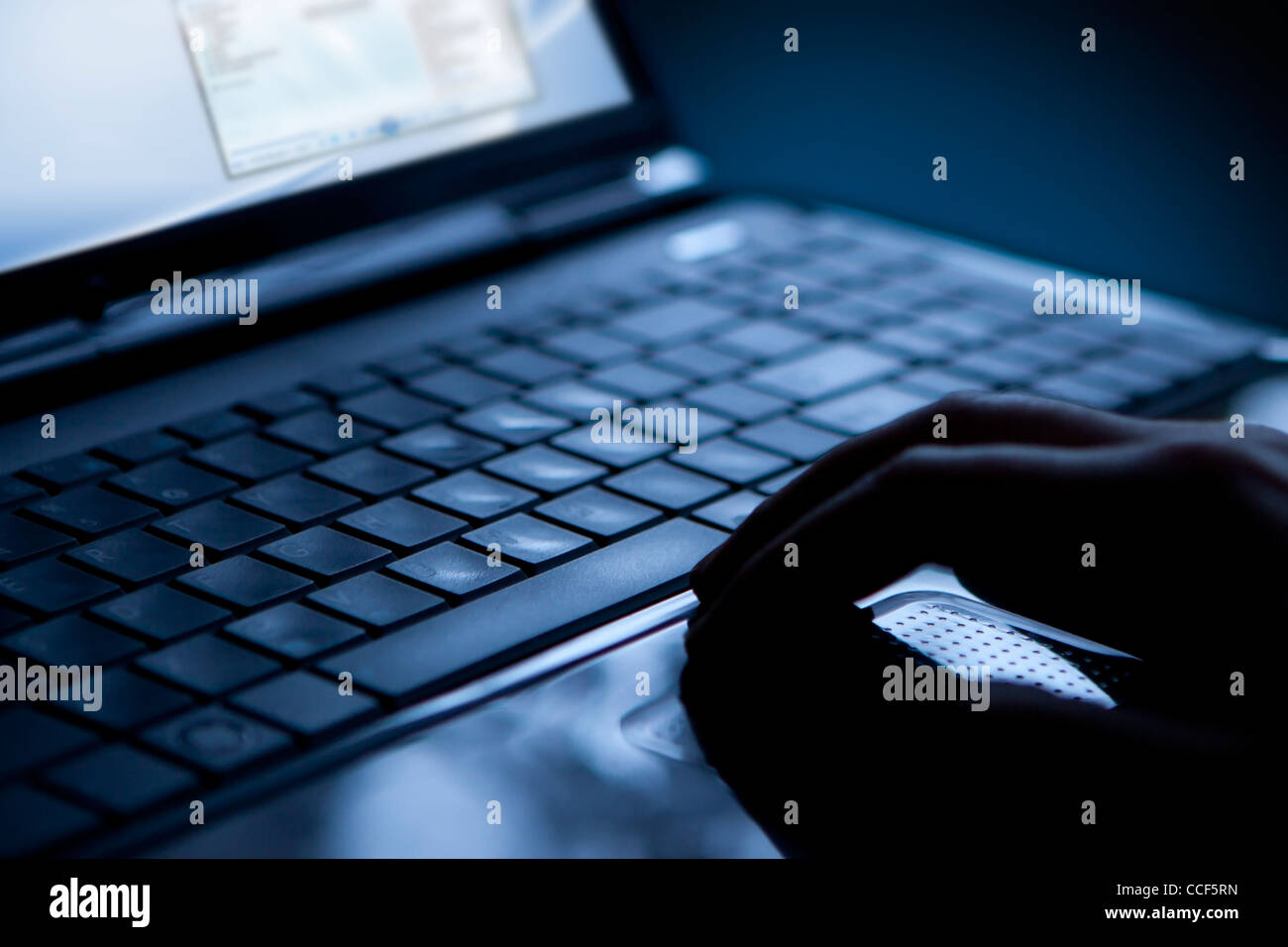 Using a laptop, finger on touchpad and keyboard Stock Photo Alamy