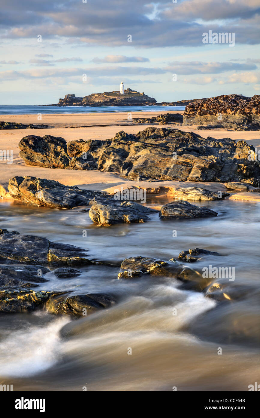 Godrevy Island in Cornwall with Godrevy Beach and the Red River in the foreground Stock Photo