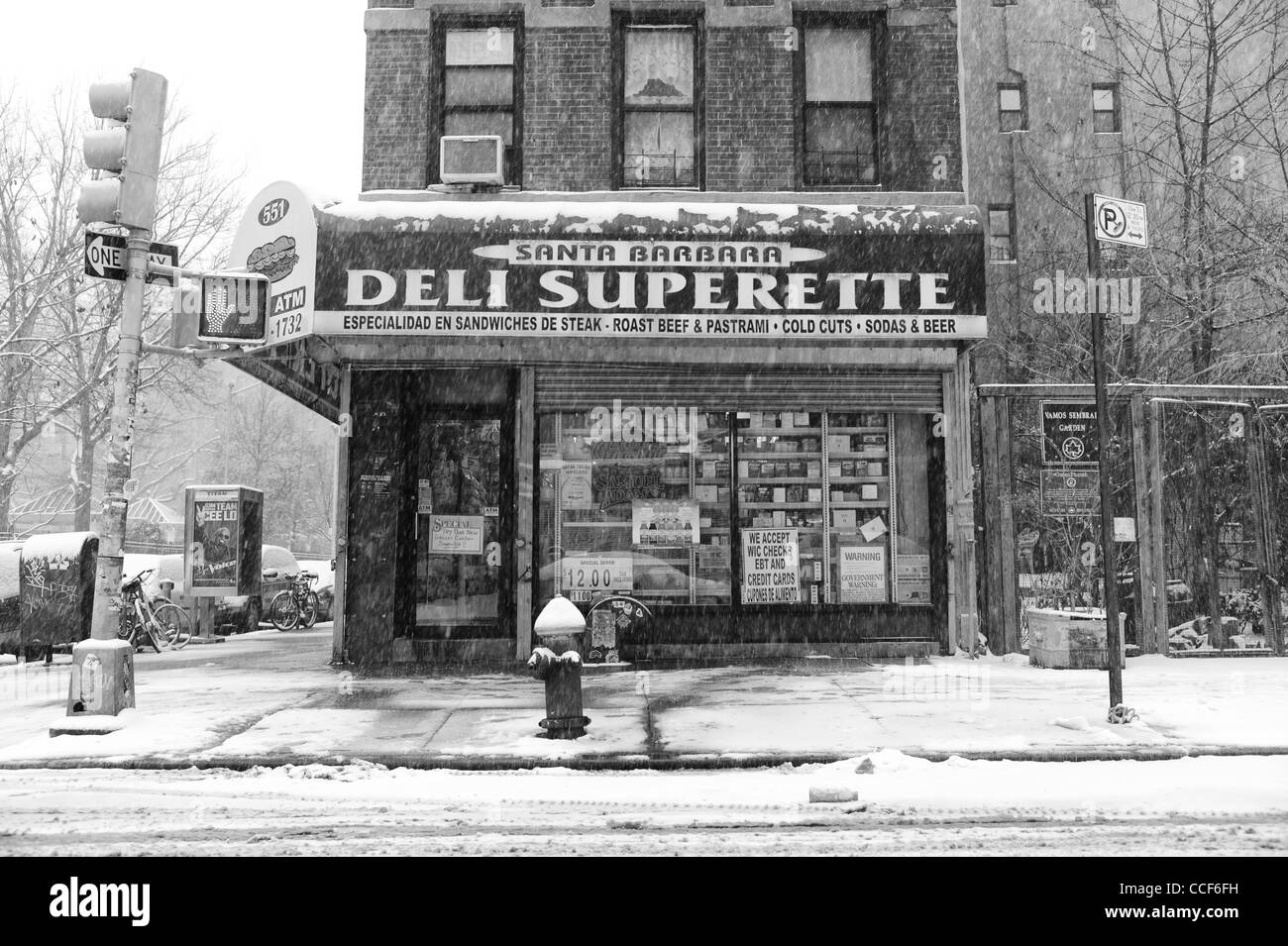 January 21st 2012: Picture shows a delicatessen as snow is seen falliing in the east village downtown New York City, USA. Stock Photo