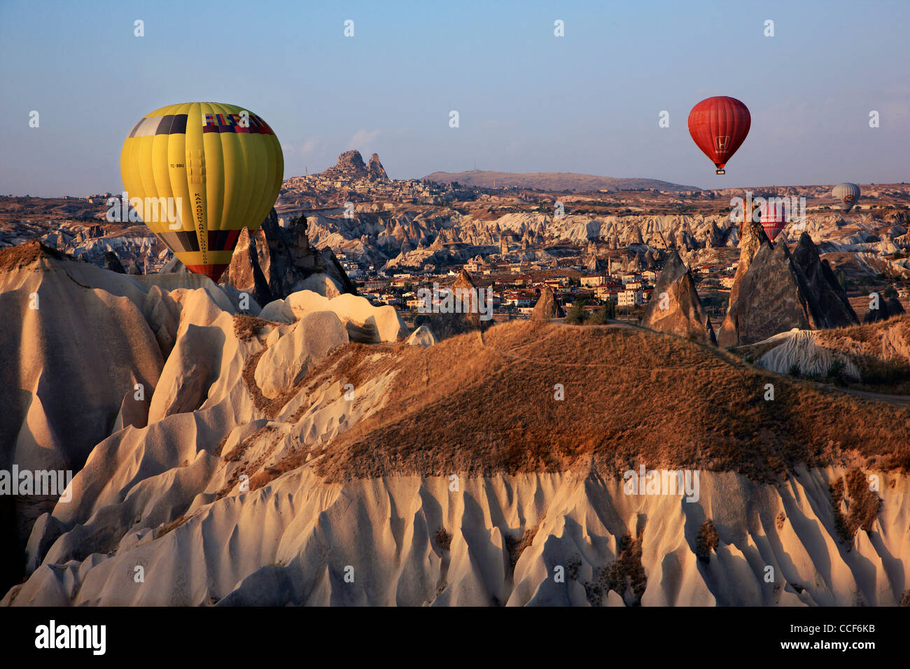 Hot air baloon flight over Cappadocia, over Pigeon valley, to be more exact. In the background Uchisar town. Turkey Stock Photo
