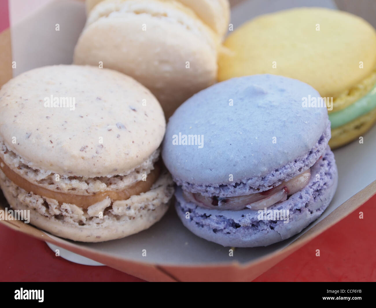 Colorful macaron pastries on a paper plate Stock Photo Alamy