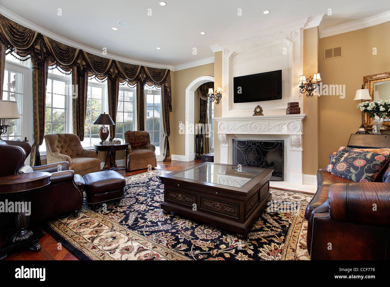 Family Room In Luxury Home With Fireplace Stock Photo 42131580