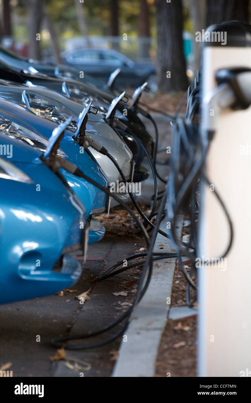 All electric Nissan Leaf cars charging. Stock Photo