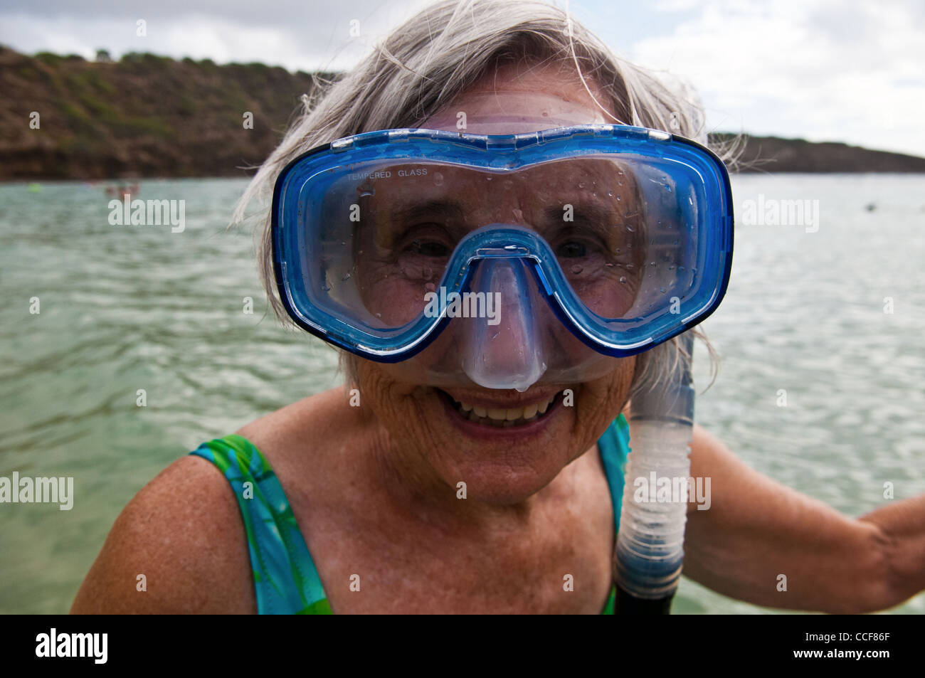 Happy woman snorkeling in Hanauma Bay, Oahu, Hawaii Stock Photo