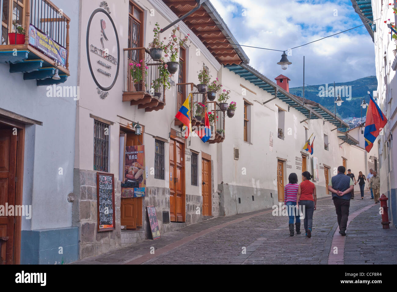 Tourists walk along the oldest street in Quito, Ecuador, Calle La Ronda. Stock Photo