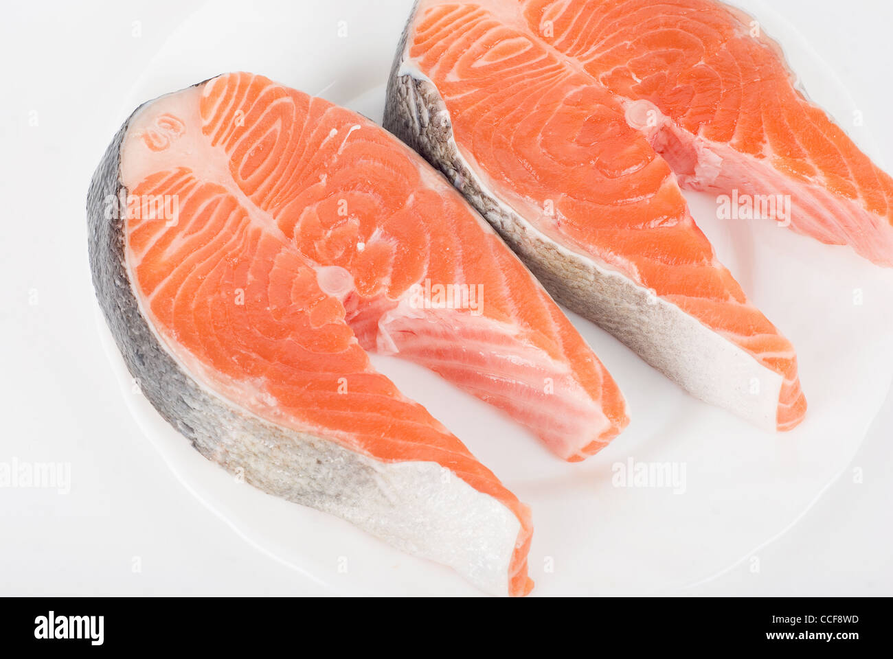 Red fish steak isolated on a white background Stock Photo - Alamy