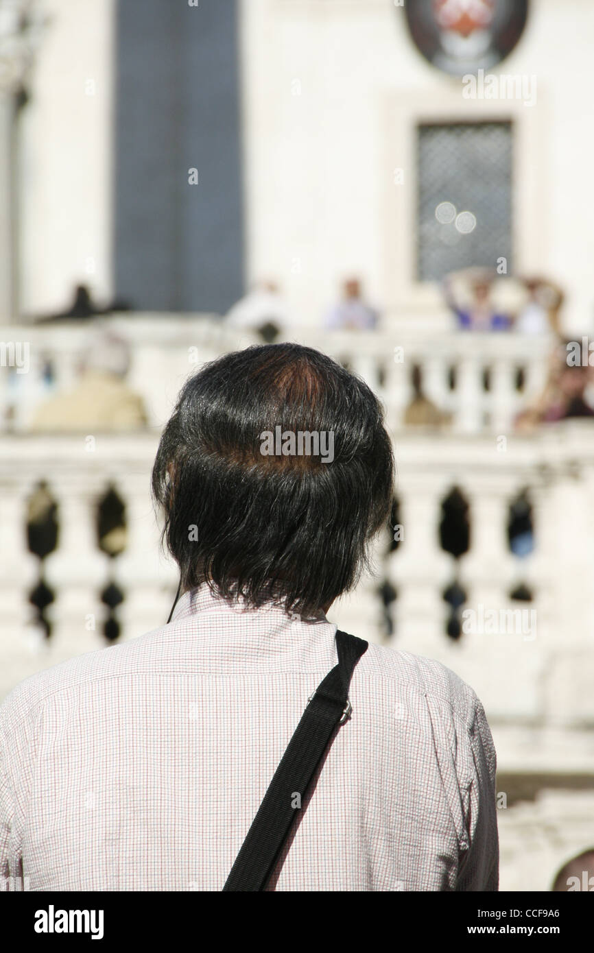 man with combed over hair style in rome italy Stock Photo