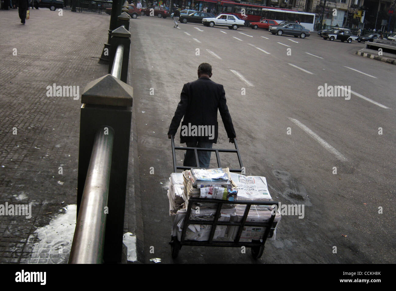 Nov. 28, 2010 - Cairo, Egypt - 20101128 - Cairo, Egypt - ..Early election morning a man wheels out the days newspapers to be sold in Midan Tahrir in central Cairo...The Egyptian parliamentary election kicked off Sunday morning as voters went to polls nationwide to select a new People's Assembly.  Th Stock Photo