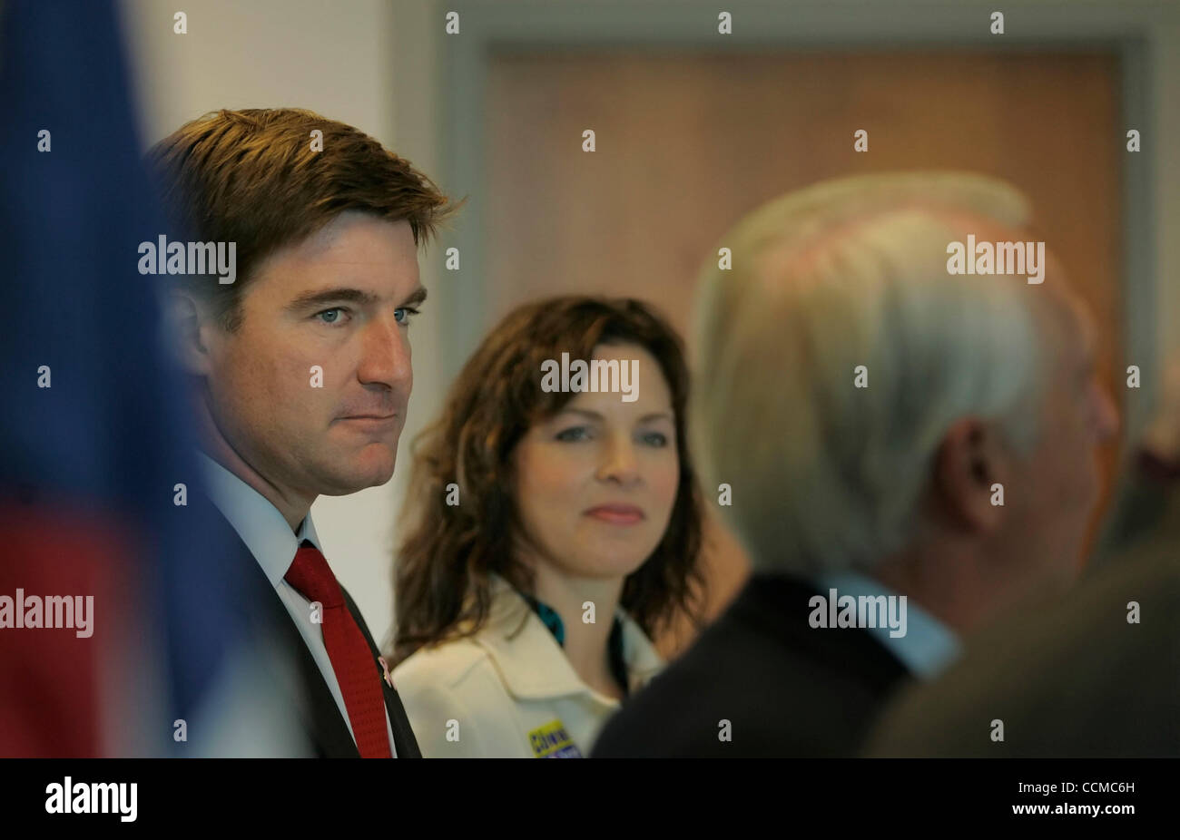 Democratic Senate nominee JACK CONWAY (left) and wife ELIZABETH CONWAY listen to Governor STEVE BESHEAR (right) during a campaign rally at the Bowling Green-Warren County Regional Airport. Both Conway and his opponent spent the day before the general election doing fly-around tours of the state. Stock Photo