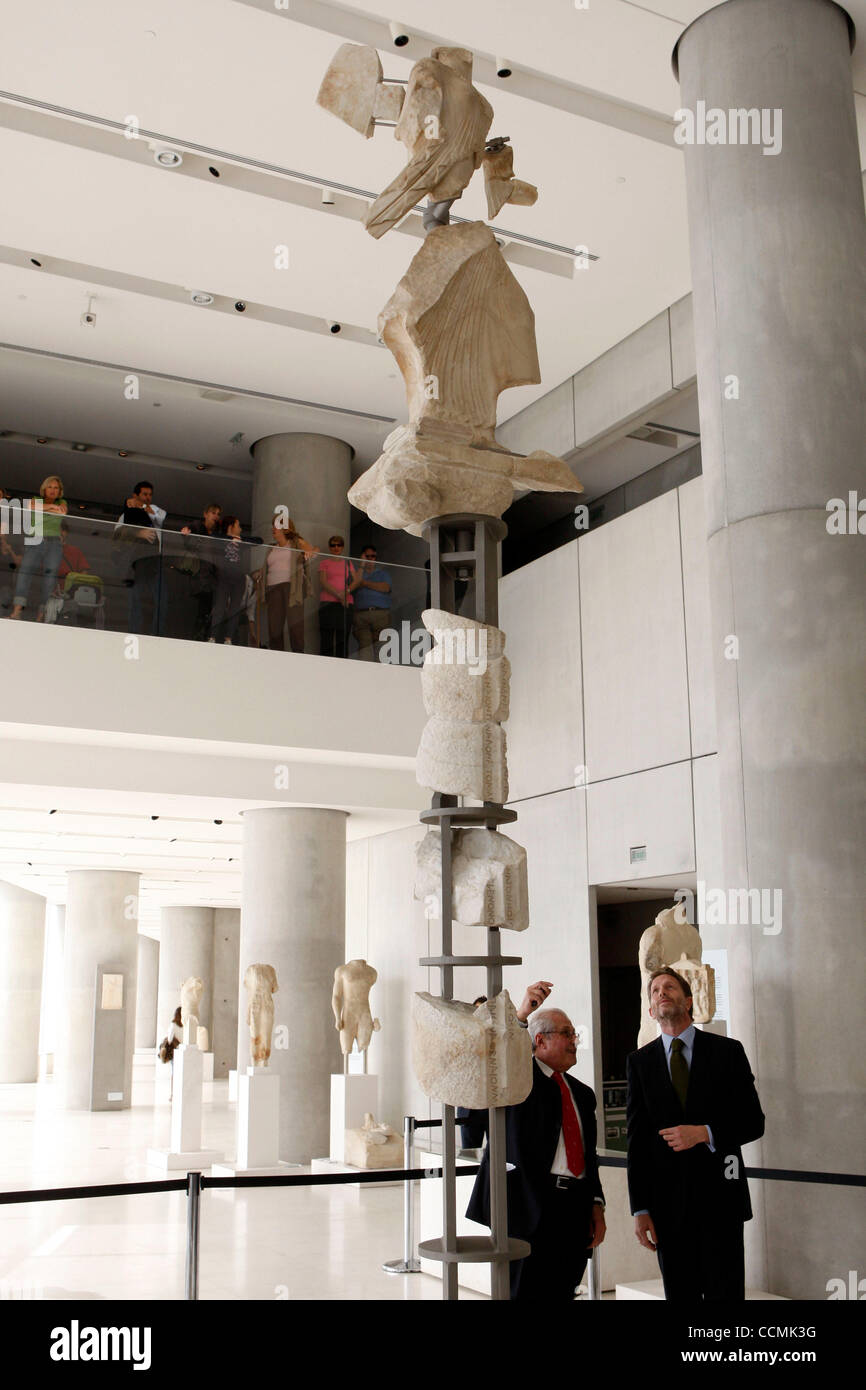 Oct. 26, 2010 - Athens, Greece - The unveiling of fragments from  ''Kallimahos Nike(victory)'' statue from Greek Minister of Culture PAVLOS  GEROULANOS(R) at the Acropolis museum. Kallimahos was one of the ten