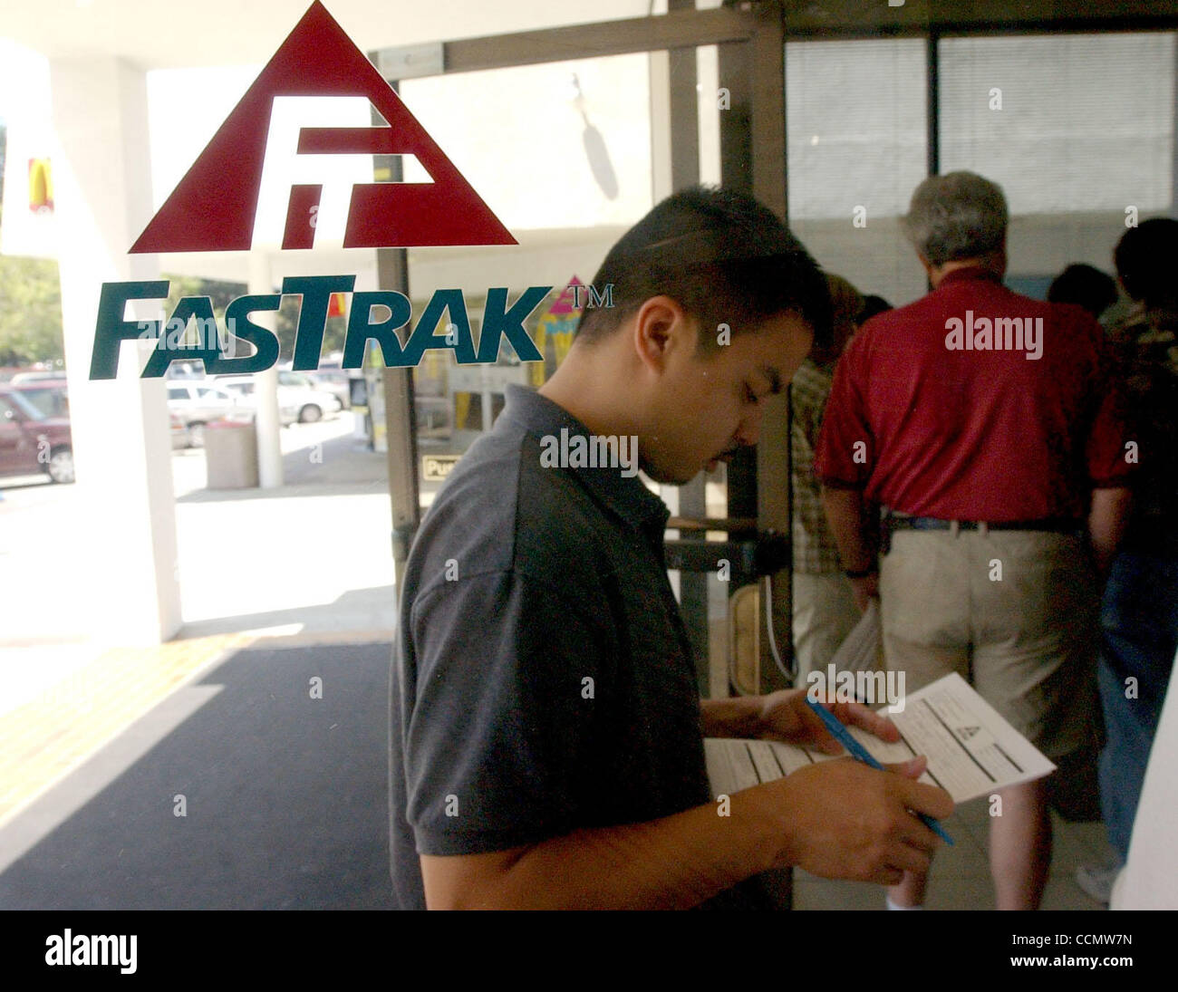 Gerald Salo,Vacaville fills out his form as he waits in a 40 minute