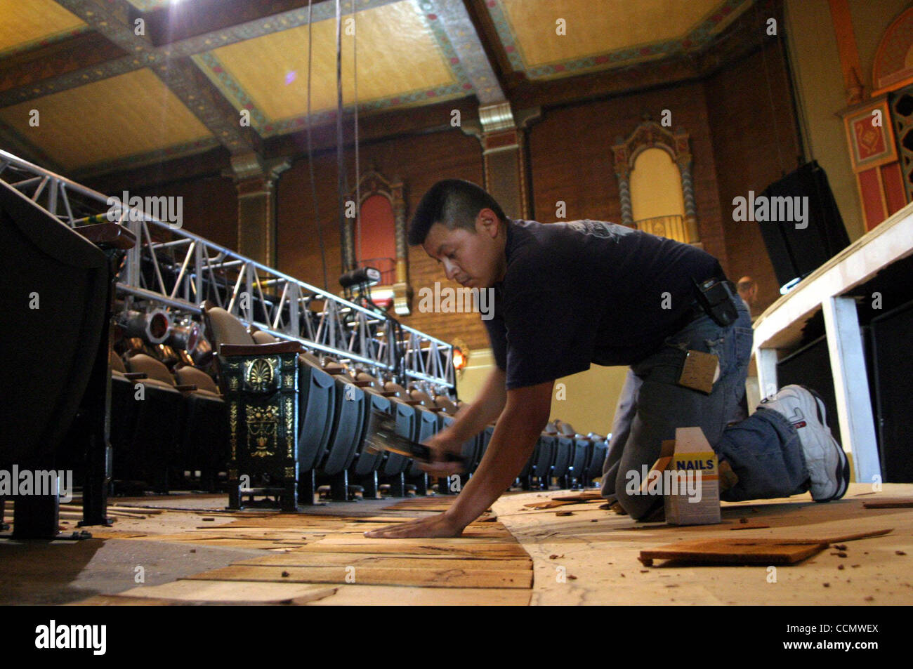 Jorge Duran (cq) works on the flooring at the El Campanil theatre in Antioch, Calif. on Thursday, June 24, 2004. The 1920's art-deco theatre is receiving a multi-million dollar facelift.  (Dean Coppola/Contra Costa Times) Stock Photo