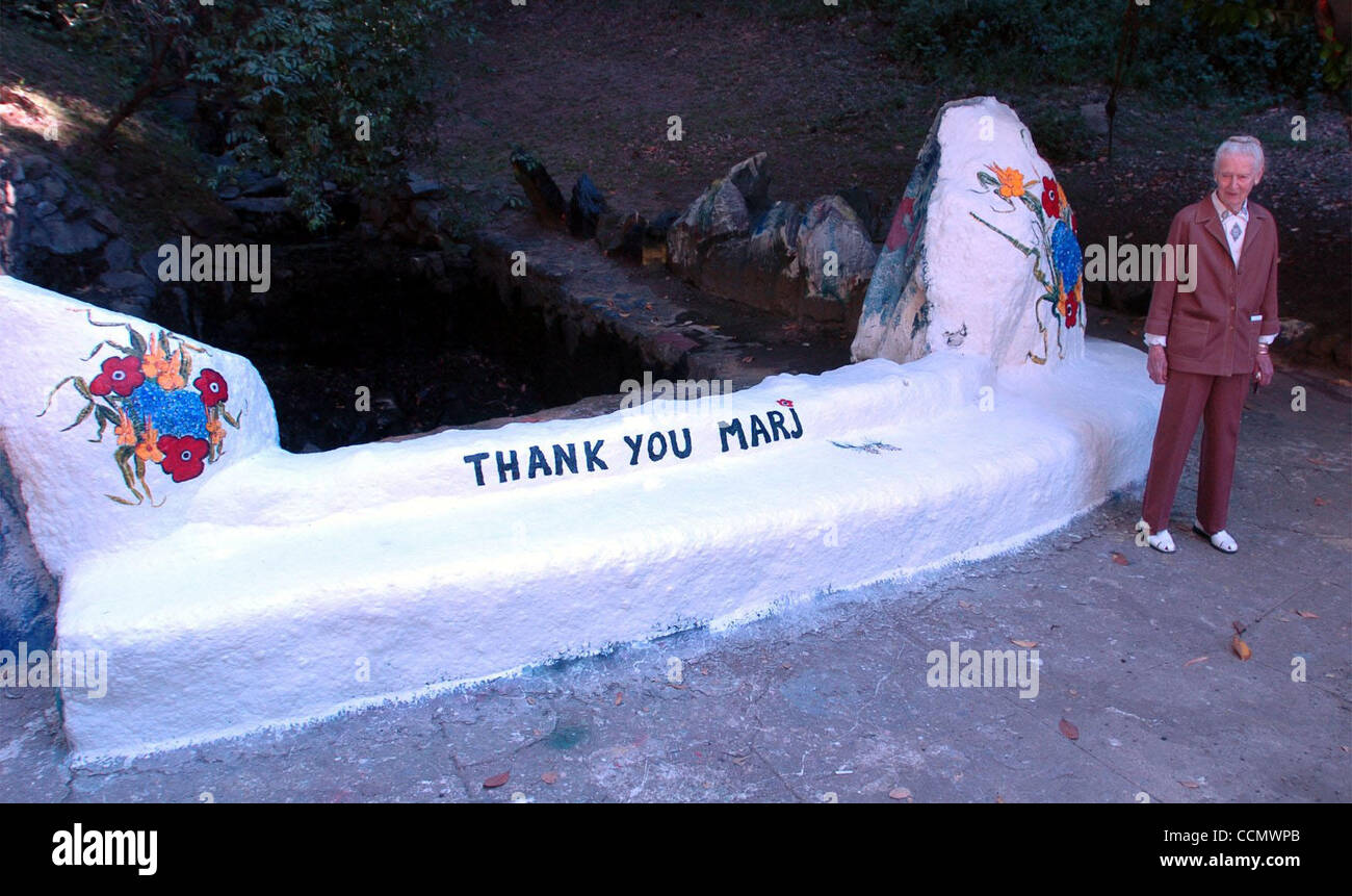 Marj Saunders looks over the park before the dedication of a park to