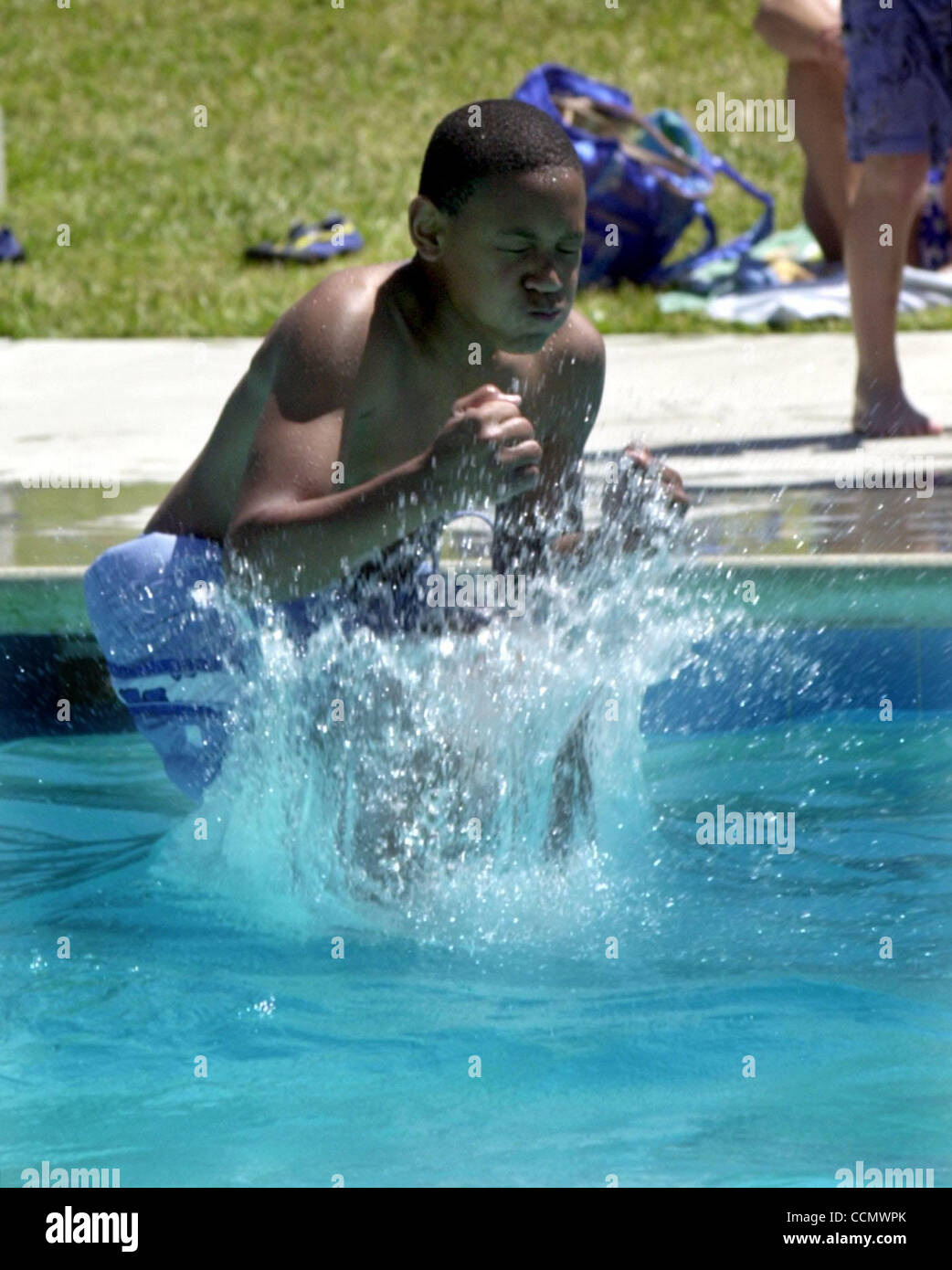 Ryan Walker, 12, has a big splash down as he goes feet first into the