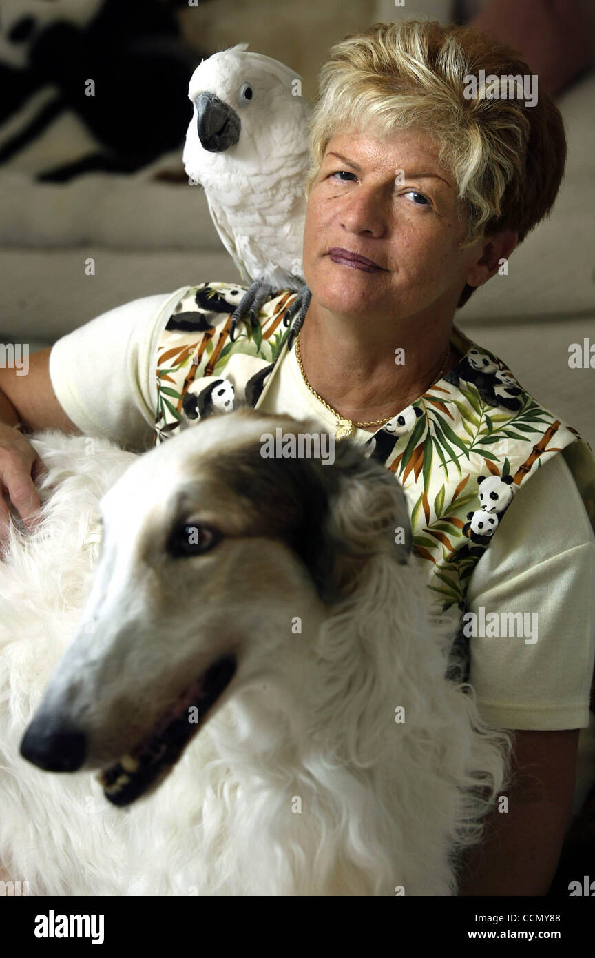 BOYNTON BEACH; 7/13/04 Carol Pistilli with her umbrella cockatoo (cq