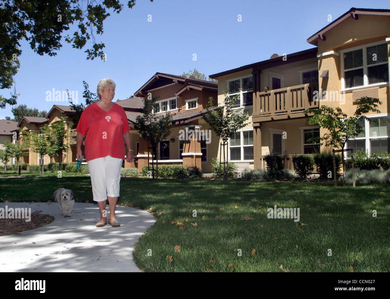 Billie Preaseau (cq) walks her dog Bandit in front of the Sycamore