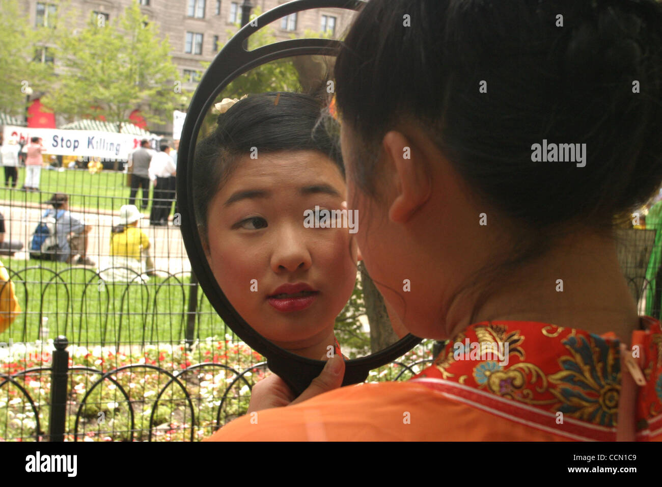 Jul 25, 2004; Boston, Ma, USA; Falun Gong practitioners bring awareness to the persecution & torture they face in China. A practitioner gets ready for the protest in Copley Square. Stock Photo