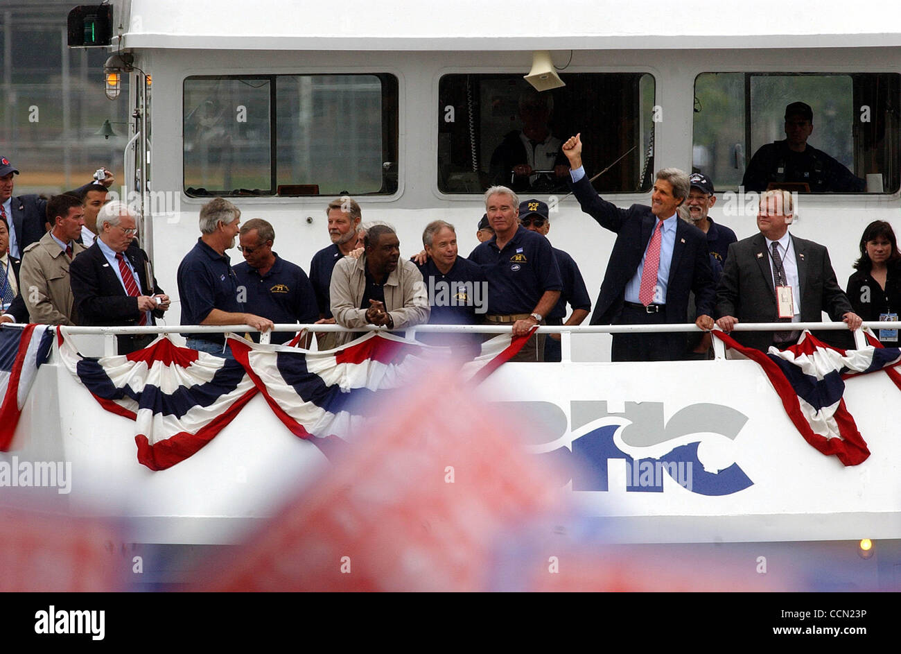 METRO-Senator John Kerry arrives by boat with his Vietnam crewmates at