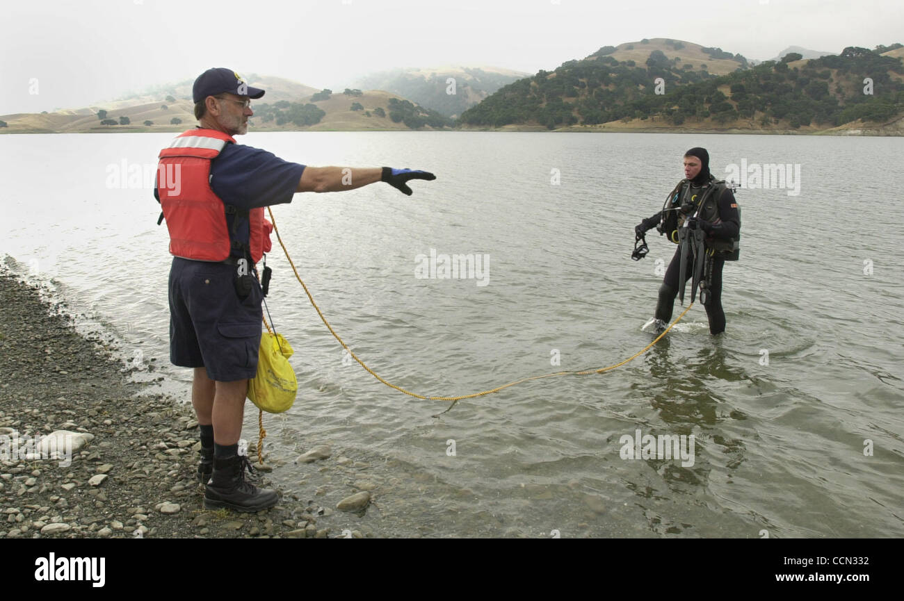 Alameda County Office of Emergency Services Search and Rescue teams hold a training and practice day at the San Antonio Reservoir where tender diver Fred Butler, left and diver Robert Storer, both of Danville, start a diving exercise Saturday, July 24, 2004, in Sunol, Calif. (Contra Costa Times/Susa Stock Photo