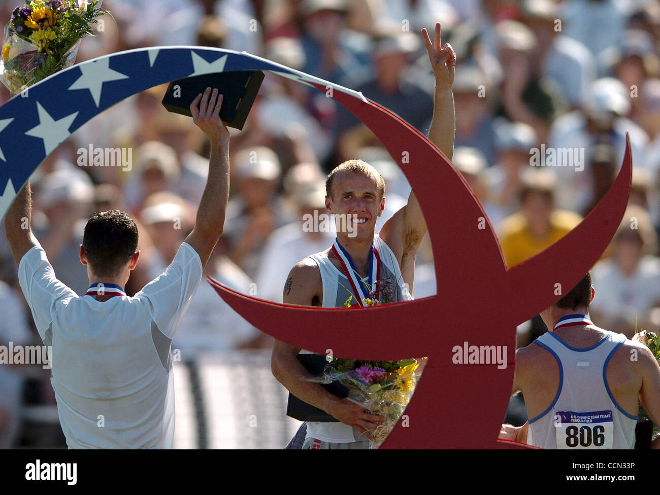 Alan Webb salutes the crowd from the awards stand after winning the 1500m in 3:36.13 Sunday July 18, 2004 at the U.S. Olympic Track and Field Trials at Alex G. Spanos Sports Complex in Sacramento, Calif.   (Contra Costa Times/Karl Mondon) Stock Photo