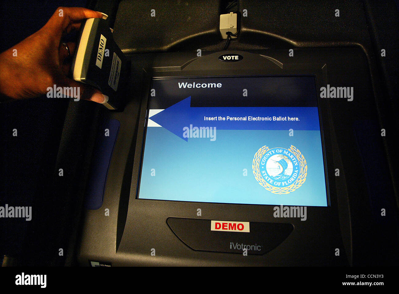 LIVE METRO, STUART, 8/6/04.....Martin County voters will be using touch screen electronic machines to cast their votes this election.  First step is the machine is activated my a poll worker. Photo by David Lane Stock Photo