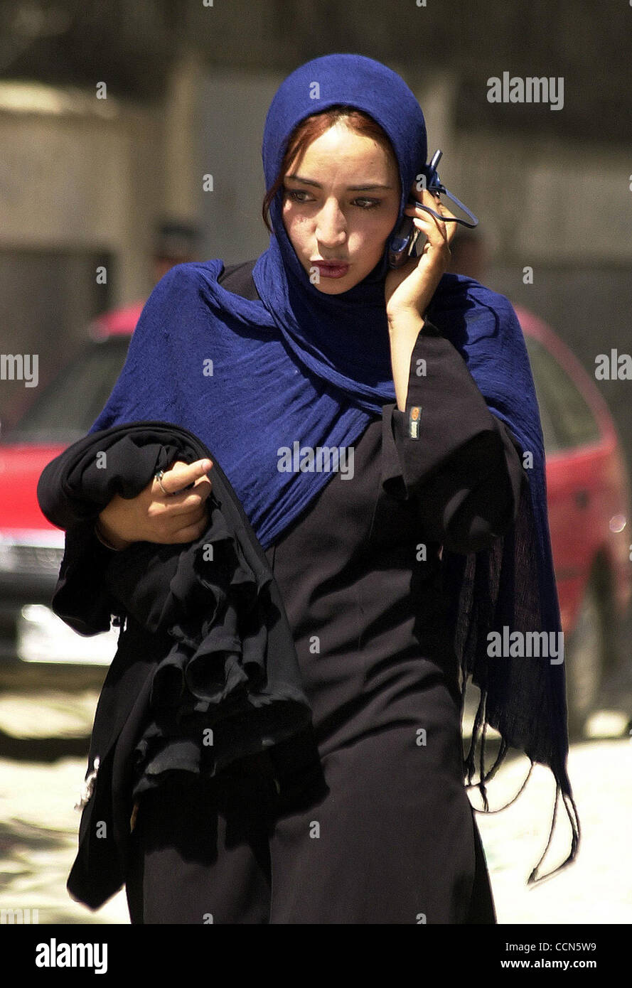 Aug 16, 2004; Kabul, AFGHANISTAN; A Afghan woman talks on her cell